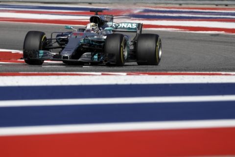 Mercedes driver Lewis Hamilton, of Britain, comes through a turn during the Formula One U.S. Grand Prix auto race at the Circuit of the Americas, Sunday, Oct. 22, 2017, in Austin, Texas. (AP Photo/Darron Cummings)