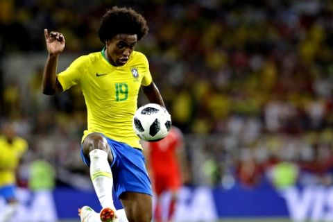 Brazil's Willian kicks the ball during the group E match between Serbia and Brazil, at the 2018 soccer World Cup in the Spartak Stadium in Moscow, Russia, Wednesday, June 27, 2018. (AP Photo/Andre Penner)