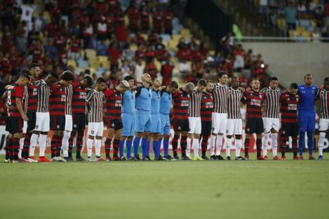 Flamengo and Fluminense soccer players pay homage to the 10 teenaged soccer players who were killed by a fire at the Flamengo training center last Friday, at Maracana Stadium in Rio de Janeiro, Brazil, Thursday, Feb. 14, 2019, before their match. (AP Photo/Leo Correa)