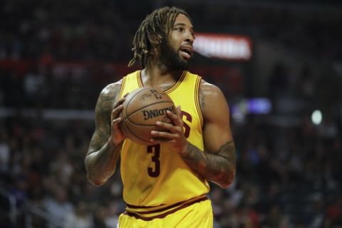 Cleveland Cavaliers' Derrick Williams looks to pass during the first half of an NBA basketball game against the Los Angeles Clippers Saturday, March 18, 2017, in Los Angeles. (AP Photo/Jae C. Hong)
