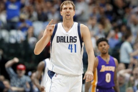 Dallas Mavericks forward Dirk Nowitzki (41) of Germany celebrates sinking a three-point basket early in the first quarter of an NBA basketball game against the Los Angeles Lakers in Dallas, Tuesday, March 7, 2017. Nowitzki reached his 30,000th career point int he first half of the game. (AP Photo/Tony Gutierrez)