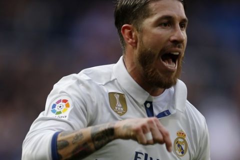 Real Madrid's Sergio Ramos celebrates after scoring a goal against Malaga during a Spanish La Liga soccer match between Real Madrid and Malaga at the Santiago Bernabeu stadium in Madrid, Saturday, Jan. 21, 2017. Ramos scored twice in Real Madrid's 2-1 victory. (AP Photo/Francisco Seco)