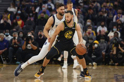 Golden State Warriors guard Stephen Curry (30) drives to the basket against Dallas Mavericks forward Maxi Kleber (42) during the first half of an NBA basketball game in San Francisco, Tuesday, Jan. 25, 2022. (AP Photo/Jed Jacobsohn)