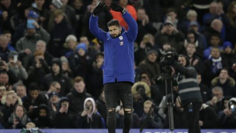 Chelsea's Olivier Giroud waves to the fans at half time after he was introduced, during the English Premier League soccer match between Chelsea and Bournemouth at Stamford Bridge in London, Wednesday Jan. 31, 2018. (AP Photo/Tim Ireland)