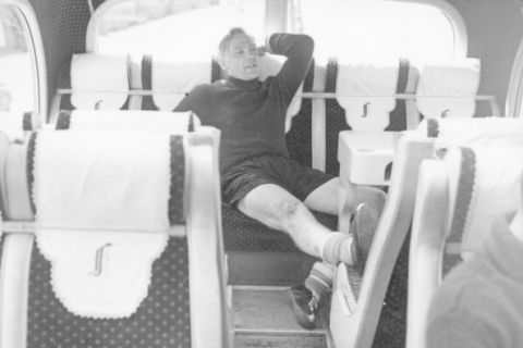 German goalkeeper Bert Trautmann (1923 - 2013), of Manchester City FC, resting in the team coach after complaining of rheumatic pains in the neck during training in Eastbourne for an FA Cup match. The following year Trautmann broke his neck in the FA CUP Final. (Photo by Popperfoto/Getty Images