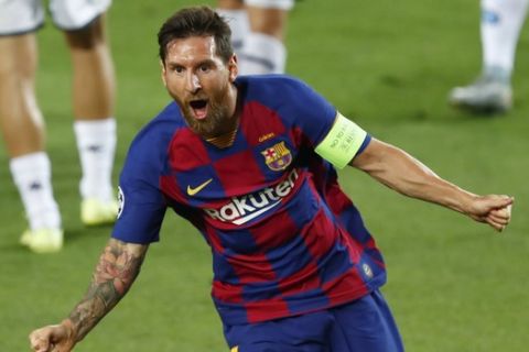 Barcelona's Lionel Messi celebrates after scoring his side's second goal during the Champions League round of 16, second leg soccer match between Barcelona and Napoli at the Camp Nou Stadium in Barcelona, Spain, Saturday, Aug. 8, 2020. (AP Photo/Joan Monfort)