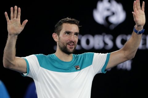 Croatia's Marin Cilic celebrates after defeating Britain's Kyle Edmund in their semifinal at the Australian Open tennis championships in Melbourne, Australia, Thursday, Jan. 25, 2018. (AP Photo/Vincent Thian)