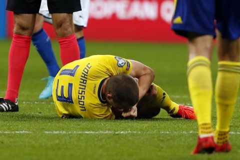 Sweden's Jakob Johansson lies on the pitch in pain during the World Cup qualifying play-off second leg soccer match between Italy and Sweden, at the Milan San Siro stadium, Italy, Monday, Nov. 13, 2017. (AP Photo/Antonio Calanni)