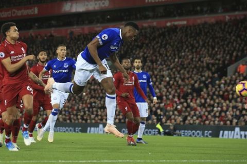 Everton defender Yerry Mina, right, fails to score during the English Premier League soccer match between Liverpool and Everton at Anfield Stadium in Liverpool, England, Sunday, Dec. 2, 2018. (AP Photo/Jon Super)