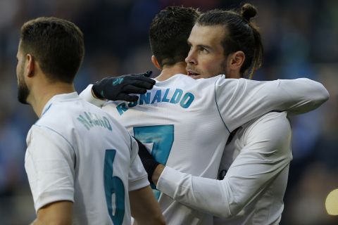 Real Madrid's Gareth Bale, right, celebrates with teammate Cristiano Ronaldo after scoring his side's third goal against Deportivo Coruna during a Spanish La Liga soccer match between Real Madrid and Deportivo Coruna at the Santiago Bernabeu stadium in Madrid, Sunday, Jan. 21, 2018. (AP Photo/Francisco Seco)