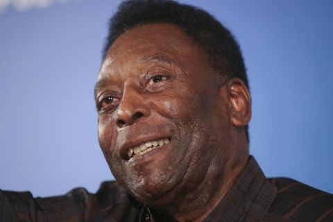 FILE - In this May 25, 2016 file photo, Brazilian soccer legend Pele attends a photocall promoting biopic, 'Pele: Birth of a Legend" in Milan, Italy. Pele's agent said Friday, Nov. 18, 2016, a widely circulated photograph of the 76-year-old soccer legend using a walker, was getting lots of attention in Brazil. He said Pele has used the walker regularly, or a cane, since he had hip surgery almost a year ago. (AP Photo/Luca Bruno, File)