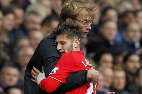 Liverpool's German manager Jurgen Klopp embraces Liverpool's English midfielder Adam Lallana (R) as he is substituted during the English Premier League football match between Tottenham Hotspur and Liverpool at White Hart Lane in north London on October 17, 2015. AFP PHOTO / IAN KINGTON

RESTRICTED TO EDITORIAL USE. No use with unauthorized audio, video, data, fixture lists, club/league logos or 'live' services. Online in-match use limited to 75 images, no video emulation. No use in betting, games or single club/league/player publications.        (Photo credit should read IAN KINGTON/AFP/Getty Images)