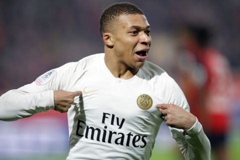 PSG's Kylian Mbappe celebrates after his team scored during the French League One soccer match between OSC Lille and Paris Saint-Germain at Stade Pierre Mauroy in Lille, France, Sunday, April 14, 2019.(AP Photo/Christophe Ena)
