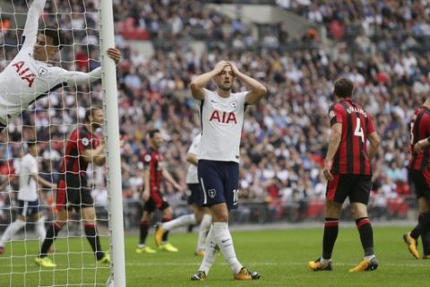 Tottenham's Harry Kane, centre, and Tottenham's Dele Alli, left, look dejected after a missed chance during the English Premier League soccer match between Tottenham Hotspur and AFC Bournemouth at Wembley stadium in London, Saturday Oct. 14, 2017. (AP Photo/Tim Ireland)