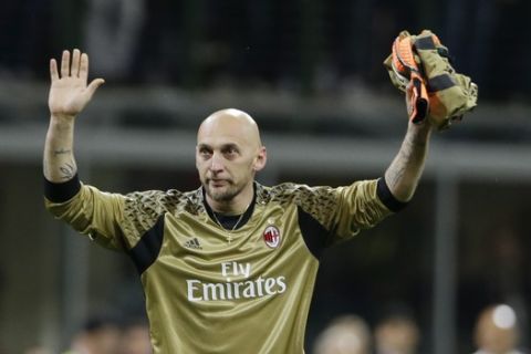 AC Milan goalkeeper Christian Abbiati waves to supporters at the end of a Serie A soccer match between AC Milan and Roma, at the San Siro stadium in Milan, Italy, Saturday, May 14, 2016. (AP Photo/Luca Bruno)