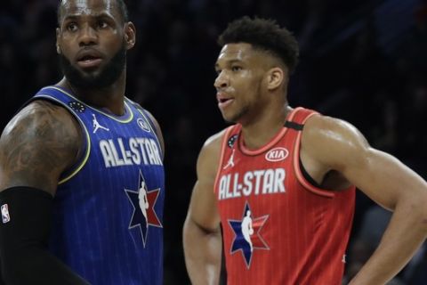 LeBron James of the Los Angeles Lakers and Giannis Antetokounmpo of the Milwaukee Bucks are seen during the second half of the NBA All-Star basketball game Sunday, Feb. 16, 2020, in Chicago. (AP Photo/Nam Huh)