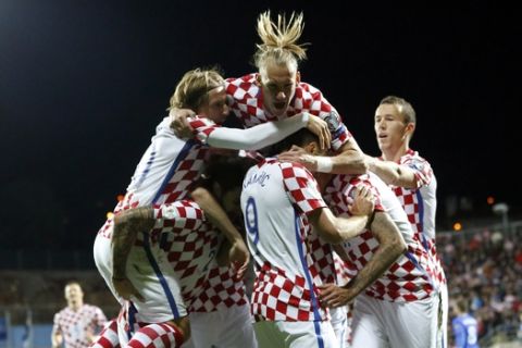 Croatia players celebrate their opening goal during the World Cup Group I qualifying soccer match between Croatia and Finland, at the Rujevica stadium in Rijeka, Croatia, Friday, Oct. 6, 2017. (AP Photo/Darko Bandic)