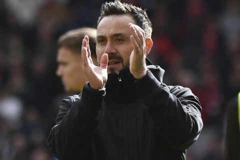 Brighton's head coach Roberto De Zerbi applauds supporters at the end of the English Premier League soccer match between Liverpool and Brighton and Hove at Anfield Stadium in Liverpool, England, Sunday, March 31, 2024. (AP Photo/Rui Vieira)