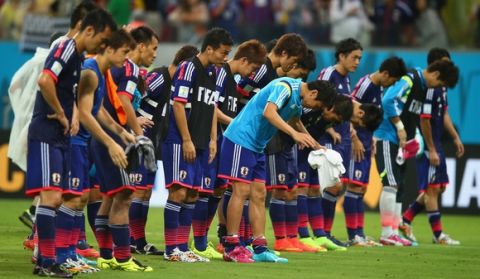 RECIFE, BRAZIL - JUNE 14:  The Japan players acknowledge the fans after being defeated by the Ivory Coast 2-1 during the 2014 FIFA World Cup Brazil Group C match  between the Ivory Coast and Japan at Arena Pernambuco on June 14, 2014 in Recife, Brazil.  (Photo by Clive Rose/Getty Images)