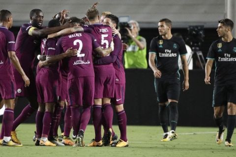 Manchester City players celebrate a goal by John Stones during the second half of an International Champions Cup soccer match against the Real Madrid Wednesday, July 26, 2017, in Los Angeles. The Manchester City won 4-1. (AP Photo/Jae C. Hong)