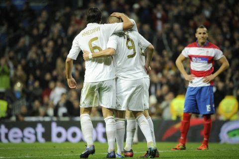 Real Madrid's soccer players celebrate after scoring during the Spanish league football match Real Madrid vs Granada on January 07, 2012 at the Santiago Bernabeu Stadium in Madrid.    AFP PHOTO/ PEDRO ARMESTRE (Photo credit should read PEDRO ARMESTRE/AFP/Getty Images)