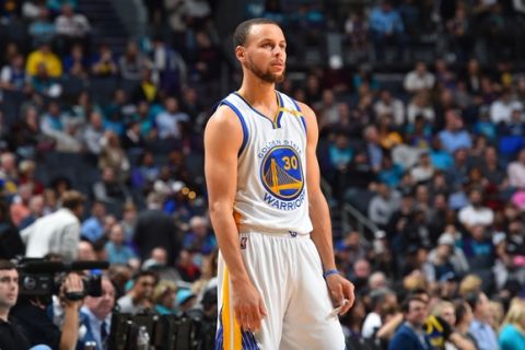 CHARLOTTE, NC - JANUARY 25: Stephen Curry #30 of the Golden State Warriors looks on against the Charlotte Hornets at Spectrum Center on January 25, 2017 in Charlotte, North Carolina NOTE TO USER: User expressly acknowledges and agrees that, by downloading and/or using this Photograph, user is consenting to the terms and conditions of the Getty Images License Agreement. Mandatory Copyright Notice: Copyright 2017 NBAE (Photo by Jesse D. Garrabrant/NBAE via Getty Images)