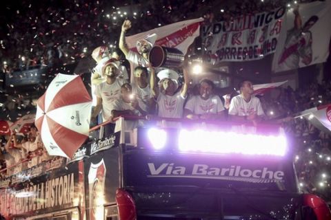 Argentina's River Plate players celebrate at their stadium in Buenos Aires, Argentina, Sunday Dec. 23, 2018. River Plate won the Copa Libertadores final against Argentina's Boca Juniors. (AP Photo/Pablo Stefanec)