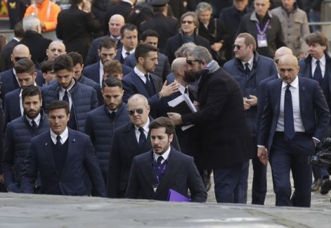 Inter of Milan players and their coach Luciano Spalletti, right, arrive for the funeral ceremony of Italian player Davide Astori in Florence, Italy, Thursday, March 8, 2018. The 31-year-old Astori was found dead in his hotel room on Sunday after a suspected cardiac arrest before his team was set to play an Italian league match at Udinese. (AP Photo/Alessandra Tarantino)