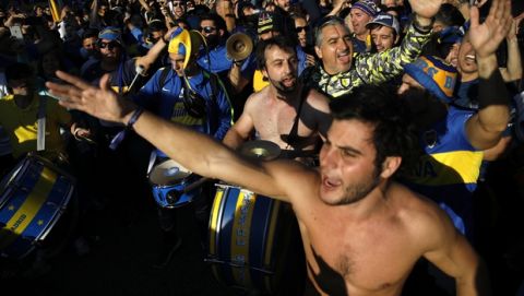 Boca Juniors supporters react ahead of the Copa Libertadores Final between River Plate and Boca Juniors in Madrid, Sunday, Dec. 9, 2018. Tens of thousands of Boca and River fans are in the city for the "superclasico" at Santiago Bernabeu Stadium on Sunday. (AP Photo/Emilio Morenatti)