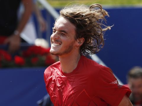 Stefanos Tsitsipas of Greece celebrates defeating Spain's Pablo Carreno Busta in two sets 7-5, 6-3, in his semifinal match against of the Barcelona Open Tennis Tournament in Barcelona, Spain, Saturday, April 28, 2018. (AP Photo/Manu Fernandez)