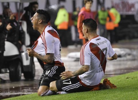 Ignacio Scocco, left, of Argentina's River Plate, celebrates after scoring against Bolivia's Wilstermann, with teammate Carlos Auzqui during a Copa Libertadores soccer match in Buenos Aires, Argentina, Thursday, September 21, 2017.(AP Photo/Gustavo Garello)