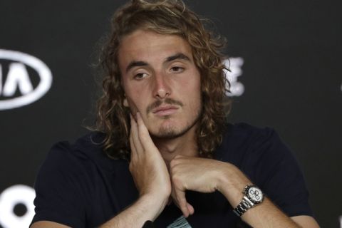Greece's Stefanos Tsitsipas answers questions at press conference following his semifinal loss to Spain's Rafael Nadal at the Australian Open tennis championships in Melbourne, Australia, Thursday, Jan. 24, 2019. (AP Photo/Aaron Favila)
