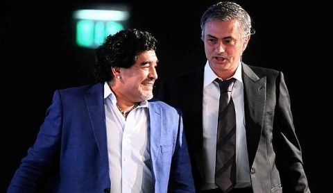 Argentinian football icon and former player Diego Maradona (L) and Real Madrid's Portuguese coach Jose Mourinho walk before attending a panel discussion during the first session of the International Sports Conference in Dubai on December 28, 2012. AFP PHOTO/MARWAN NAAMANI
