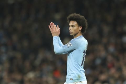 Manchester City's Leroy Sane, applauds a teammate during their English Premier League soccer match between Manchester City and Liverpool at the Ethiad stadium, Manchester England, Thursday, Jan. 3, 2019. (AP Photo/Jon Super)
