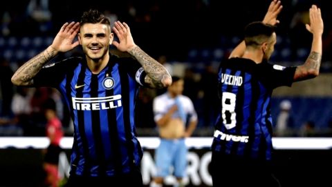 Inter Milan's Mauro Icardi, left, celebrates after he scored his side's third goal during a Serie A soccer match between Lazio and Inter Milan, at Rome's Olympic stadium, Monday, Oct. 29, 2018. (AP Photo/Alessandra Tarantino)