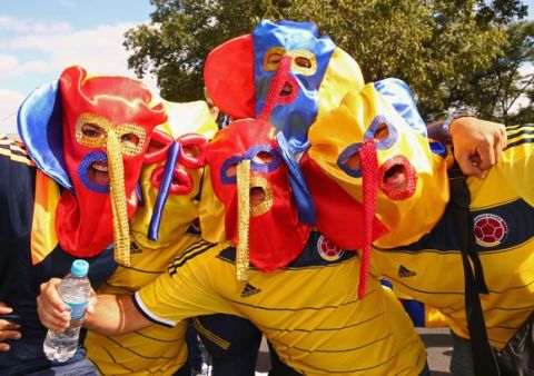 BELO HORIZONTE, BRAZIL - JUNE 14: Colombia fans enjoys the atmosphere whilst wearing Marimonda masks prior to the 2014 FIFA World Cup Brazil Group C match between Colombia and Greece at Estadio Mineirao on June 14, 2014 in Belo Horizonte, Brazil.  (Photo by Ian Walton/Getty Images)