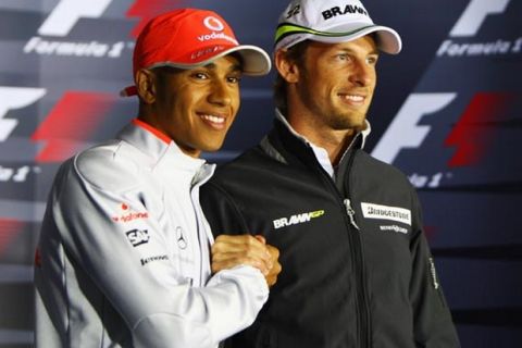 NORTHAMPTON, UNITED KINGDOM - JUNE 18:  Lewis Hamilton (L) of Great Britain and McLaren Mercedes and Jenson Button (R) of Great Britain and Brawn GP attend the drivers press conference during previews to the British Formula One Grand Prix at Silverstone on June 18, 2009, in Northampton, England.  (Photo by Paul Gilham/Getty Images) *** Local Caption *** Lewis Hamilton;Jenson Button
