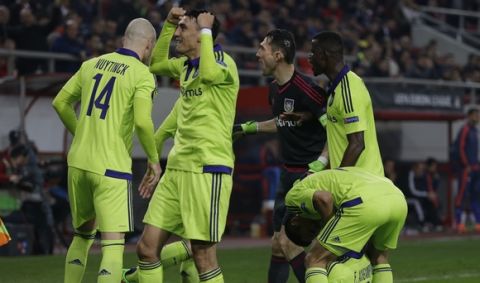 Anderlecht's players celebrate their team's goal in extra time during the Europa League round of 32 soccer match between Olympiakos and Anderlecht at the Georgios Karaiskakis stadium in the port of Piraeus, near Athens, Thursday, Feb. 25, 2016. (AP Photo/Thanassis Stavrakis) 