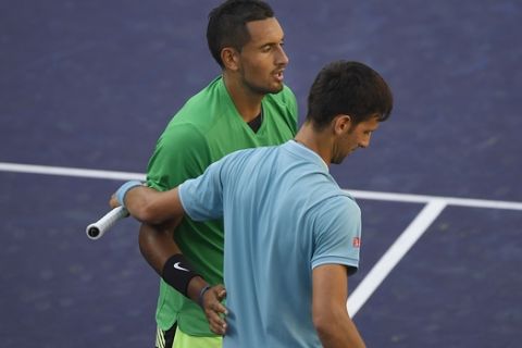 Nick Kyrgios, of Australia, top, shakes hands with Novak Djokovic, of Serbia, after Kyrgios beat Djokovic at the BNP Paribas Open tennis tournament, Wednesday, March 15, 2017, in Indian Wells, Calif. (AP Photo/Mark J. Terrill)