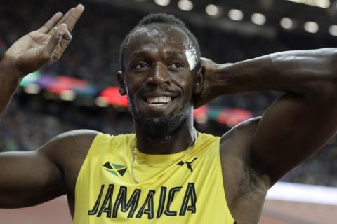 Jamaica's Usain Bolt gestures after placing third in the men's 100m final during the World Athletics Championships in London Saturday, Aug. 5, 2017. (AP Photo/Matthias Schrader)