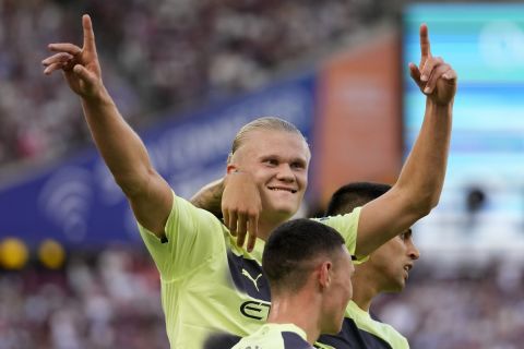 Manchester City's Erling Haaland celebrates after scoring his sides second goal during the English Premier League soccer match between West Ham United and Manchester City at the London Stadium in London, England, Sunday, Aug. 7, 2022. (AP Photo/Frank Augstein)