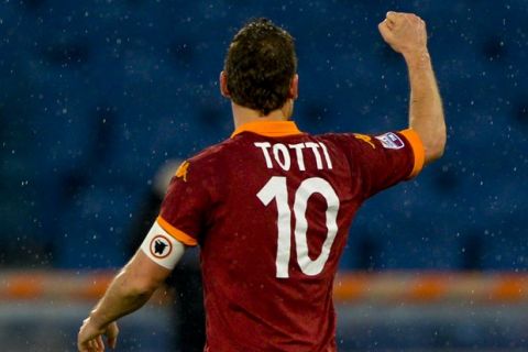 AS Roma forward Francesco Totti celebrates after scoring during the Italian Serie A football match AS Roma vs. Parma on March 17, 2013 at Rome's Olympic stadium. AFP PHOTO / ANDREAS SOLARO        (Photo credit should read ANDREAS SOLARO/AFP/Getty Images)