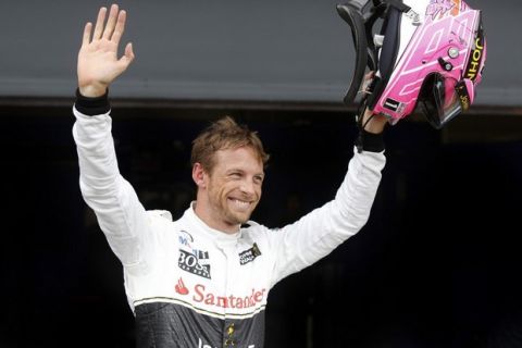Jenson Button waves to the crowd after qualifying.