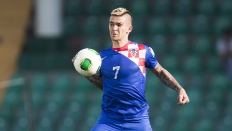 Croatias's Marko Livaja stops the ball during the Under-20 World Cup round of 16 soccer match between Croatia and Chile in Bursa, Turkey, Wednesday, July 3, 2013. (AP Photo/Gero Breloer)