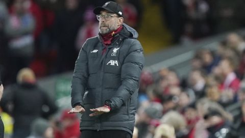 Liverpool's manager Jurgen Klopp gives instructions during the English FA Cup third round soccer match between Liverpool and Everton at Anfield stadium in Liverpool, England, Sunday, Jan. 5, 2020. (AP Photo/Jon Super)