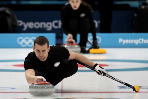 FILE - In this Feb. 7, 2018 file photo, Russian curler Alexander Krushelnitsky practices ahead of the 2018 Winter Olympics in Gangneung, South Korea. Russian curlers say a coach on their team told them that mixed doubles bronze medalist Krushelnitsky tested positive for a banned substance at the Pyeongchang Olympics. (AP Photo/Aaron Favila, File)