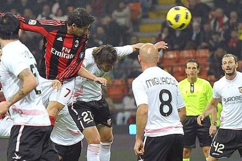 AC Milan's Pato (top L) jumps to score as he is challenged by Palermo's Armin Bacinovic during their Italian Serie A soccer match at San Siro stadium in Milan November 10, 2010. REUTERS/Giorgio Perottino (ITALY - Tags: SPORT SOCCER)