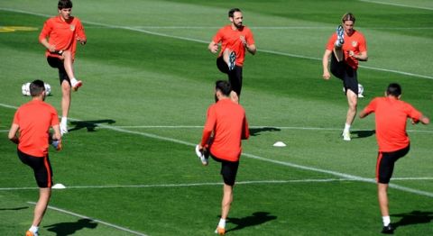 "MADRID, SPAIN - APRIL 26:  The Atletico Madrid players stretch during a training session ahead of the UEFA Champions League Semi-Final First Leg between Club Atletico de Madrid and Bayern Meunchen at Majadahonda training ground on April 26, 2016 in Madrid, Spain.  (Photo by Denis Doyle/Getty Images)"