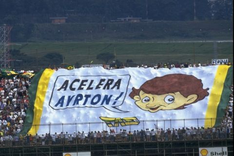 1994:  Fans hold a huge flag in support of Williams Renault driver Ayrton Senna of Brazil during the Brazilian Grand Prix at the Interlagos circuit in Brazil. Senna retired from the race after spinning off the track and stalling. \ Mandatory Credit: Pascal  Rondeau/Allsport