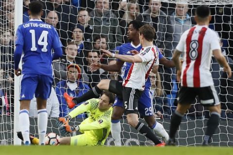 Chelsea's goalkeeper Asmir Begovic makes a save during the English FA Cup soccer match between Chelsea and Brentford at Stamford Bridge stadium in London, Saturday, Jan. 28, 2017. (AP Photo/Kirsty Wigglesworth)